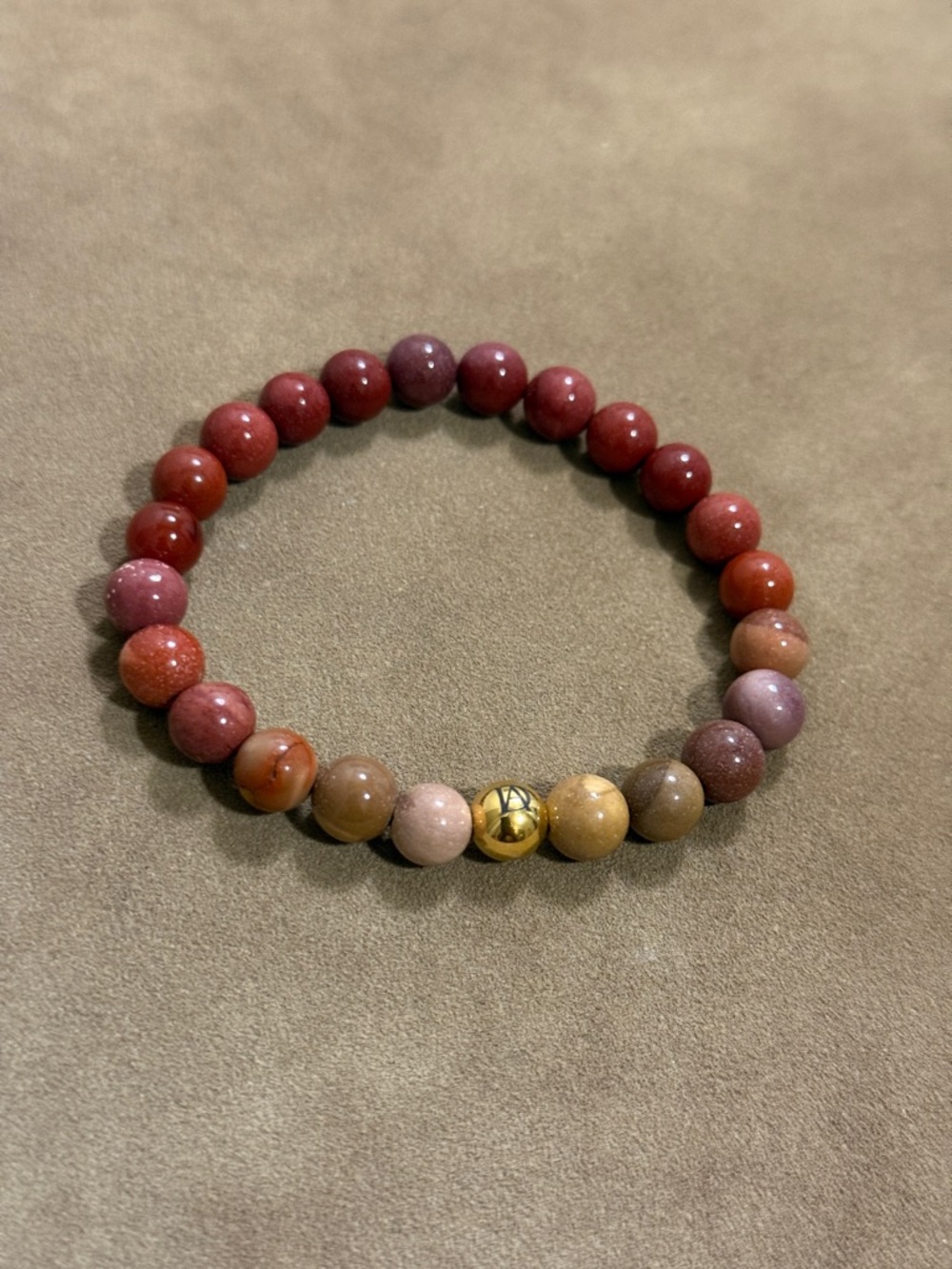 Stretch Beaded Bracelet with Red and Brown Gemstone Beads and Gold Accent